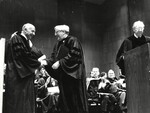 Dr. John V. Thornton presenting an Honorary Degree to Senator Javits (left)