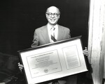 Abraham S. Goldstein, Sterling Professor of Law, Yale Law School, displaying his Honorary Degree from New York Law School