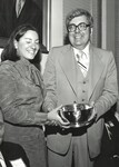 Christina Storm ’77 (left), Chairperson of the New York Law School Moot Court Team, presents Dean E. Donald Shapiro (right) with the trophy won by the team at the Kaufman Moot Court competition by New York Law School