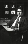 Professor Botein seated before several television monitors