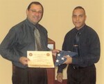 Flag flown on behalf of NYLS, with Celestino Martinez and Dean Matasar
