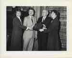 The Honorable William Joseph Brennan Jr., with Dean James Simon, Noreen Krasnogor & Sherri Donovan holding a plaque at the 1986 Commencement by New York Law School